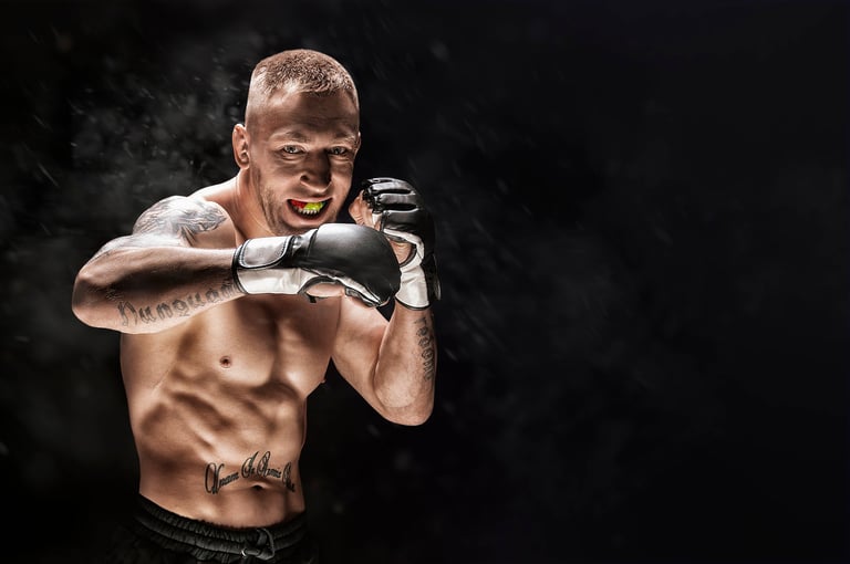 Mixed martial artist posing on a black background