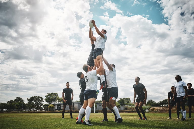 Shot of two rugby teams competing over a ball during a line out of a rugby match