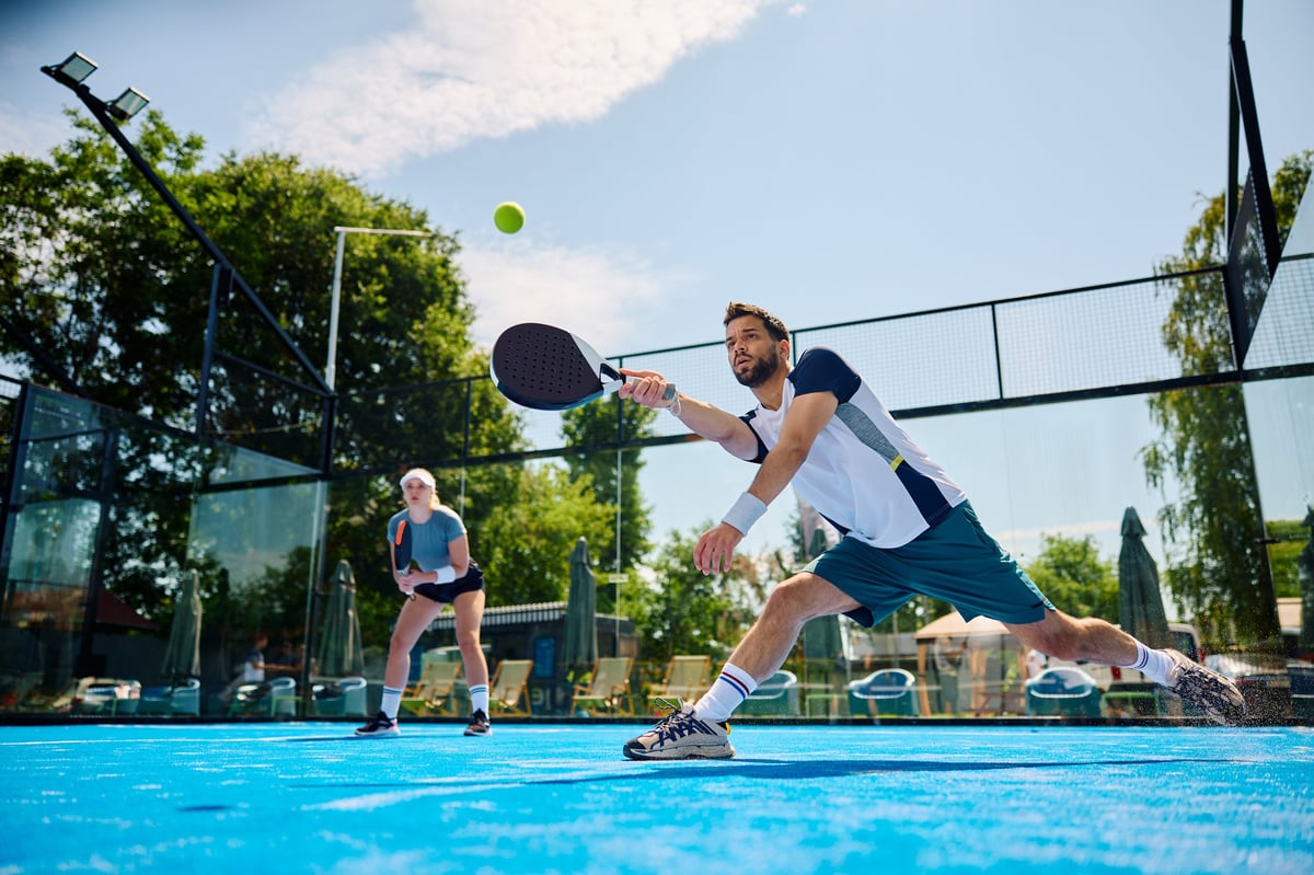 Young athlete playing padel