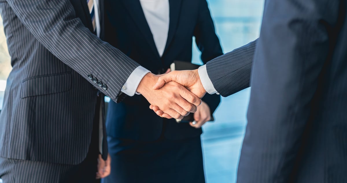 Business professionals shaking hands