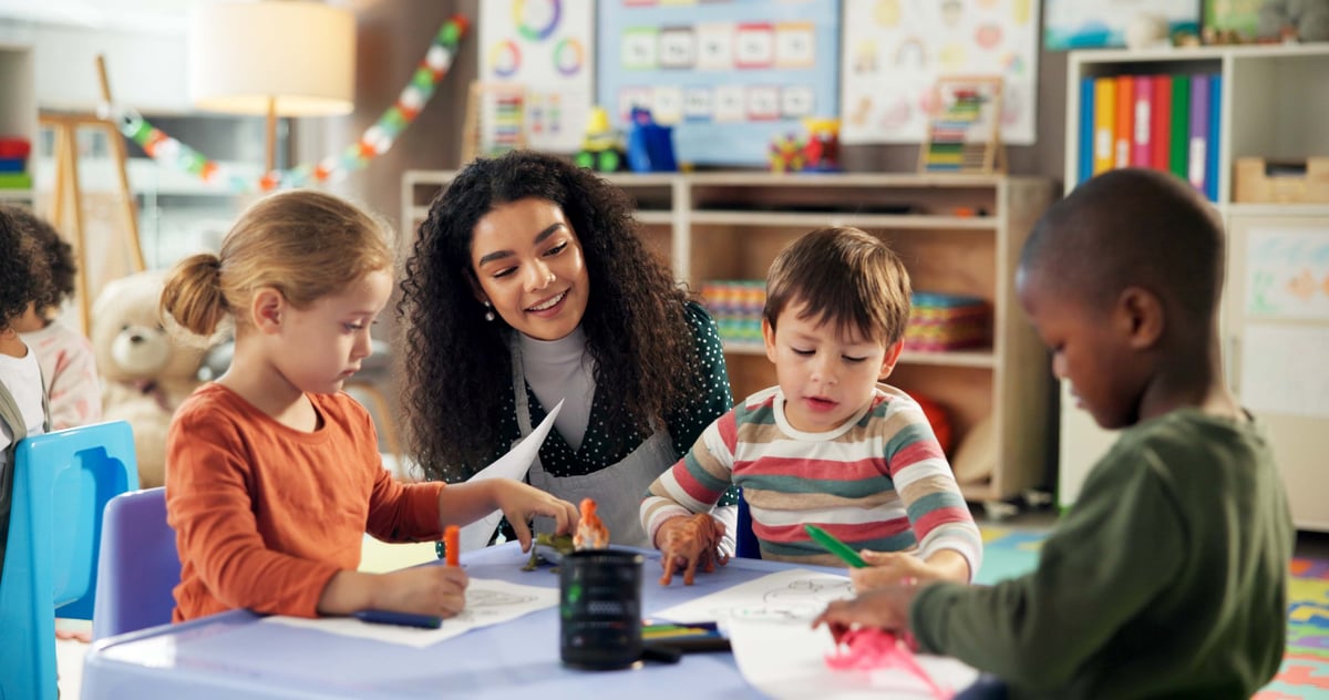 Children learning and drawing in classroom