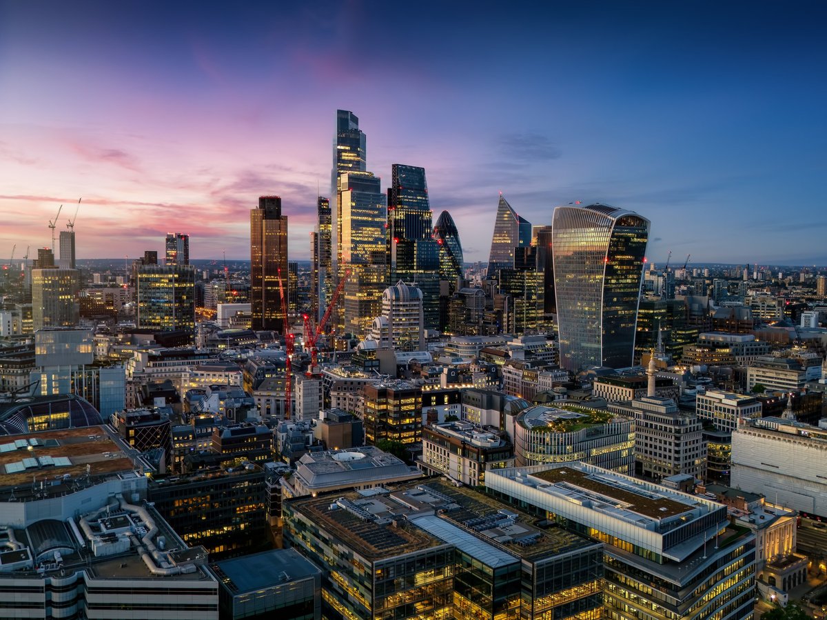 Illuminated city skyline at dusk