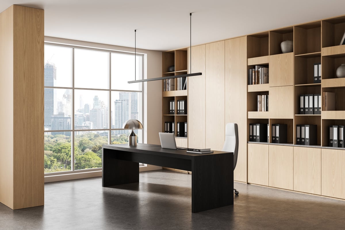 Contemporary executive office interior with wooden shelves and large city view window, featuring minimalist furniture and clean modern design. 3D Rendering