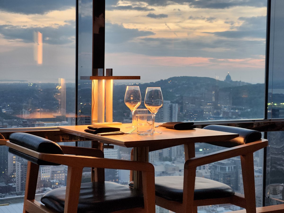 Elegant restaurant table set with wine glasses and soft ambient lighting