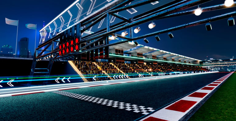 Racetrack starting grid with lights and grandstands at night