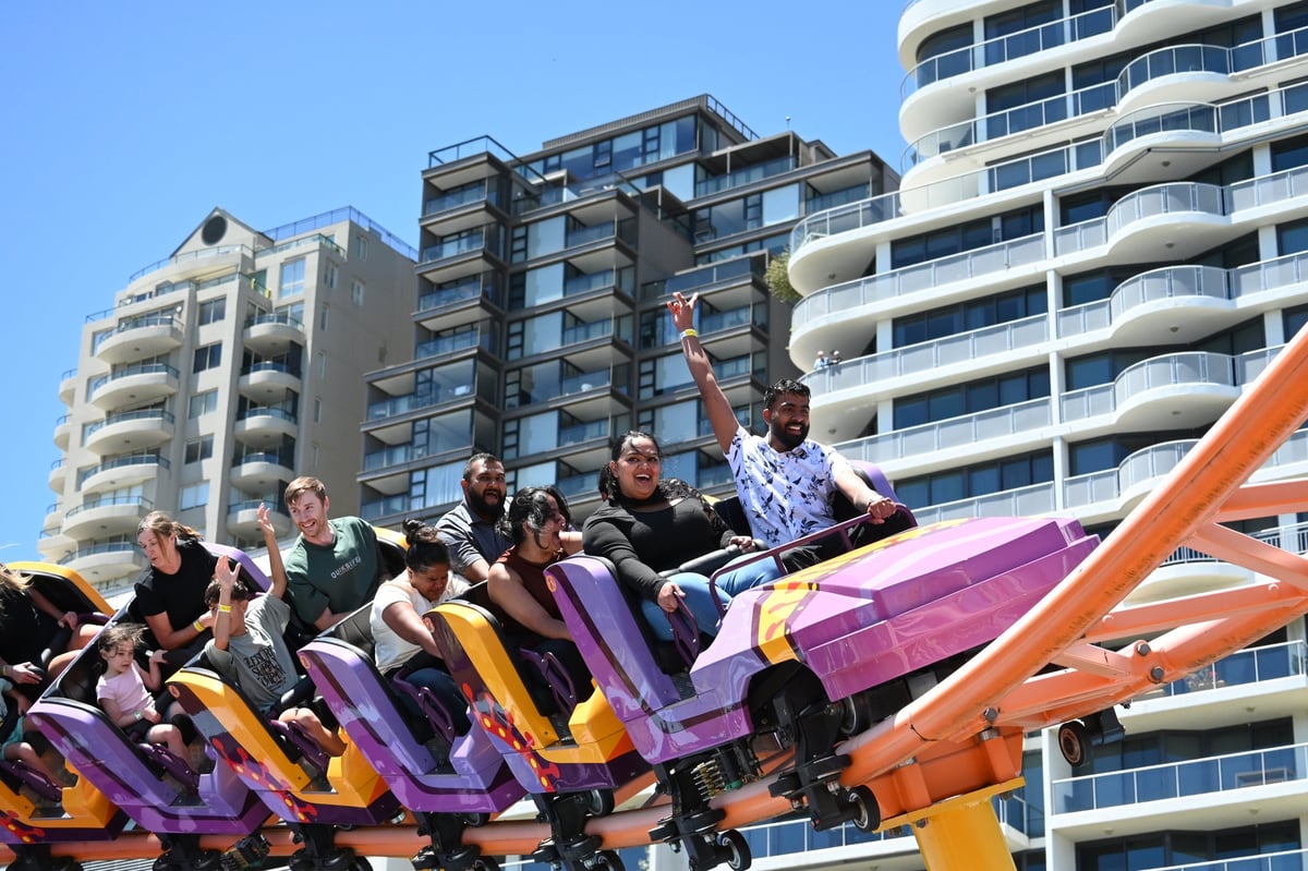 Family enjoying a theme park ride together