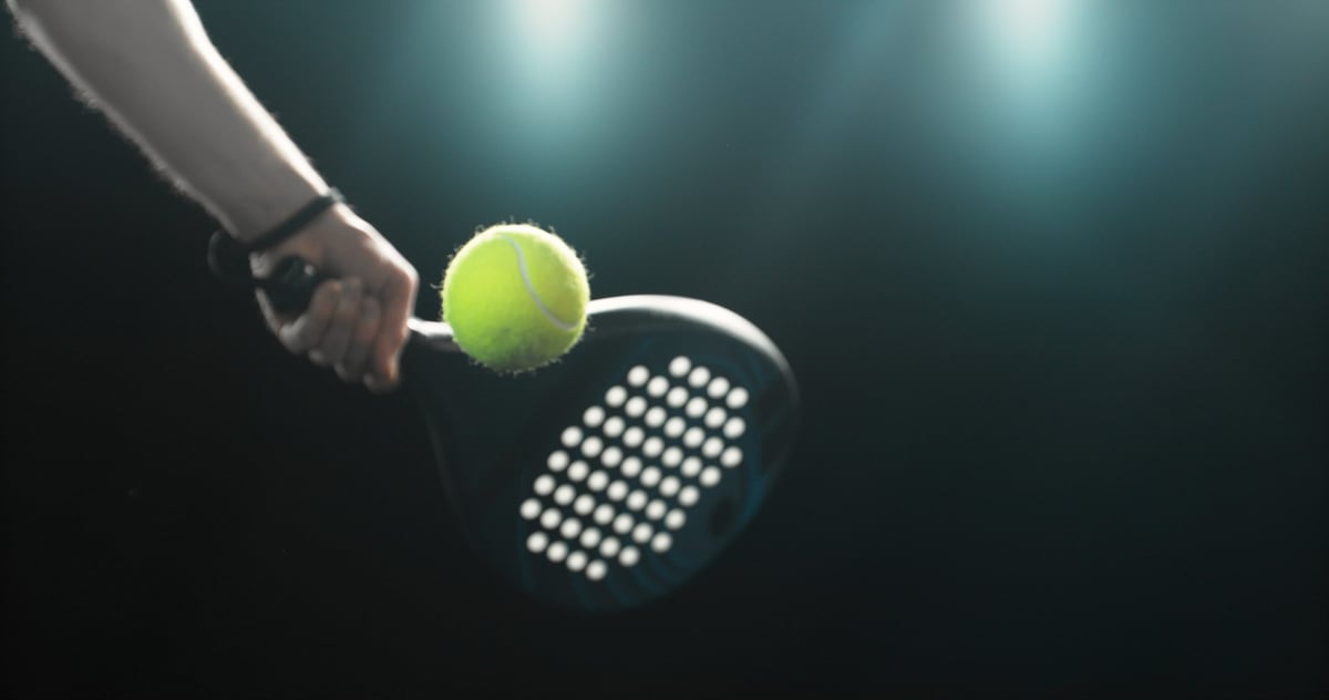 Dynamic action shot of a padel player