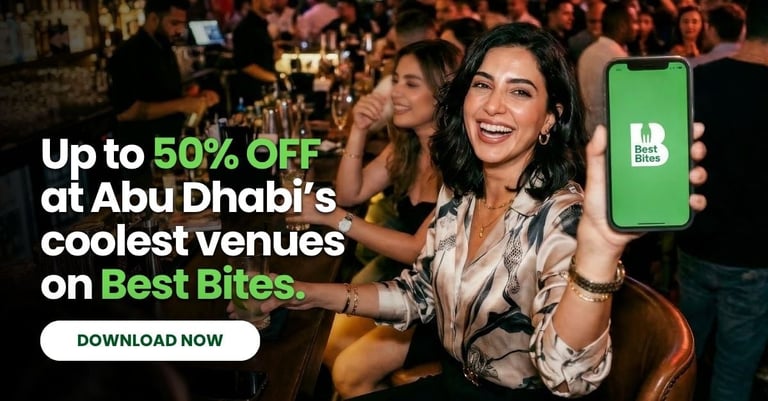 Woman at Abu Dhabi venue holding phone with Best Bites app showing up to 50% off discount offer