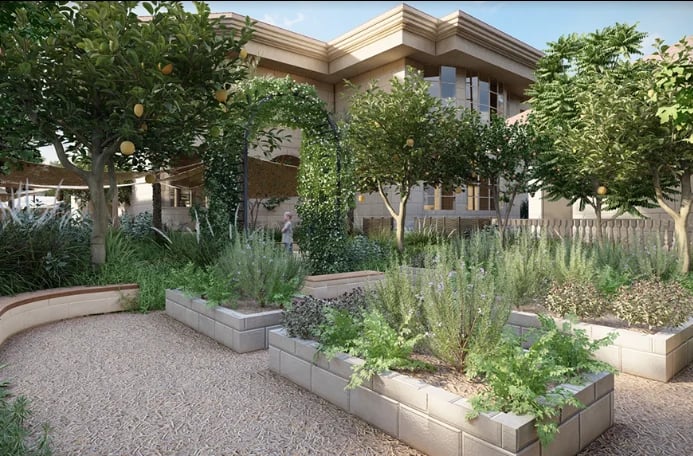 Modern home with drought-resistant garden featuring raised beds, gravel pathways, and green plants in a landscaped yard