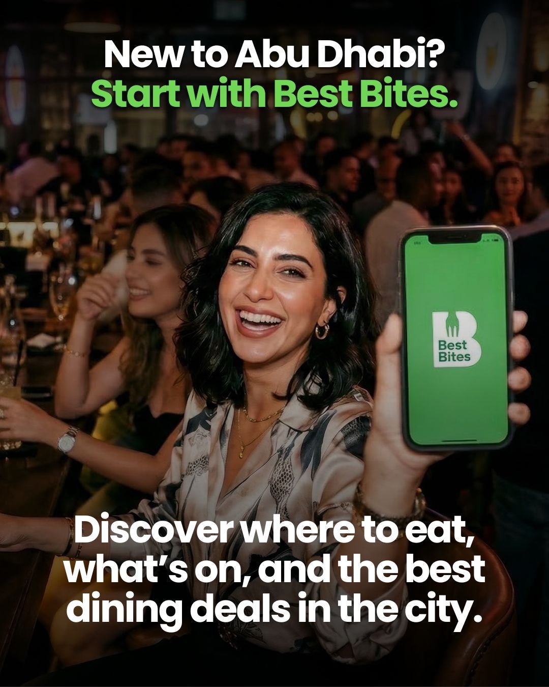Woman holding smartphone displaying Best Bites app at social gathering, promoting dining guide for Abu Dhabi
