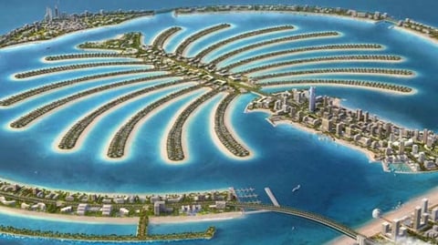 Aerial view of Palm Jumeirah, Dubai, showing distinctive palm-shaped artificial islands with turquoise water and luxury residential development
